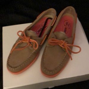 Sperry Topsider beige and pink boat shoes.
